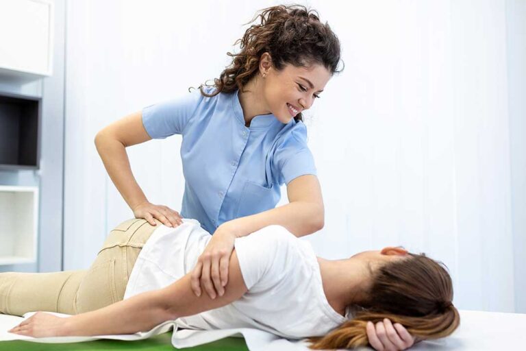 Adult performing gentle back and hip exercises on a mat in a bright home room.